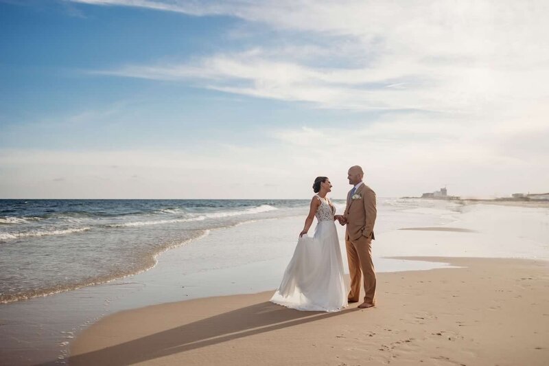 A couple captures their wedding portraits after their Gulf Shores wedding
