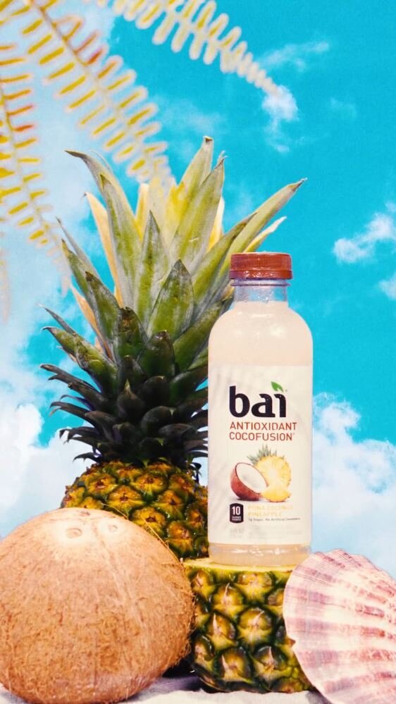 Tropical-themed social media content featuring Bai Antioxidant Cocofusion with pineapple, coconut, and seashell