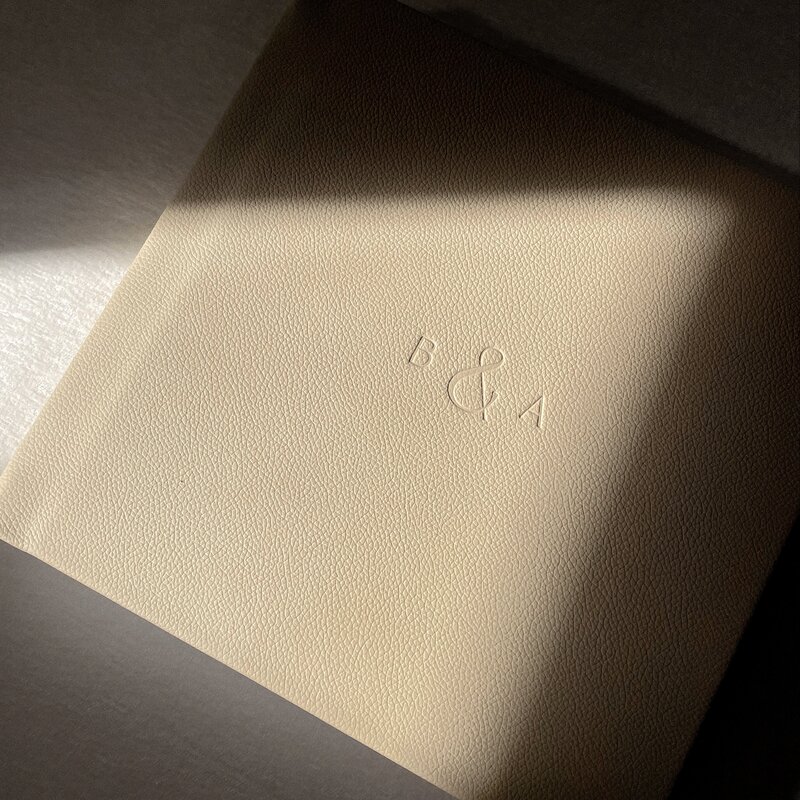 Cover of a Britni Dean heirloom wedding album monogrammed with B and A