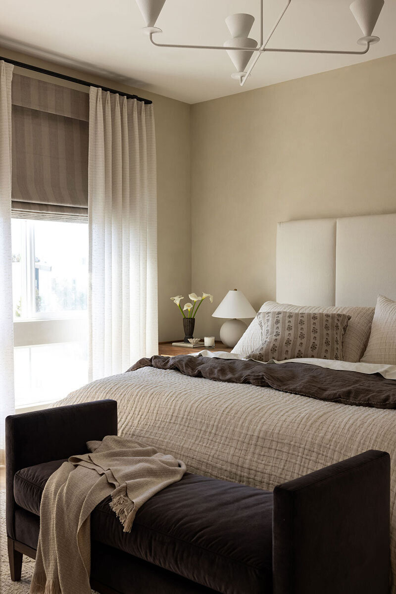 Bedroom with seamless design and warm interiors typical of Coastal California homes
