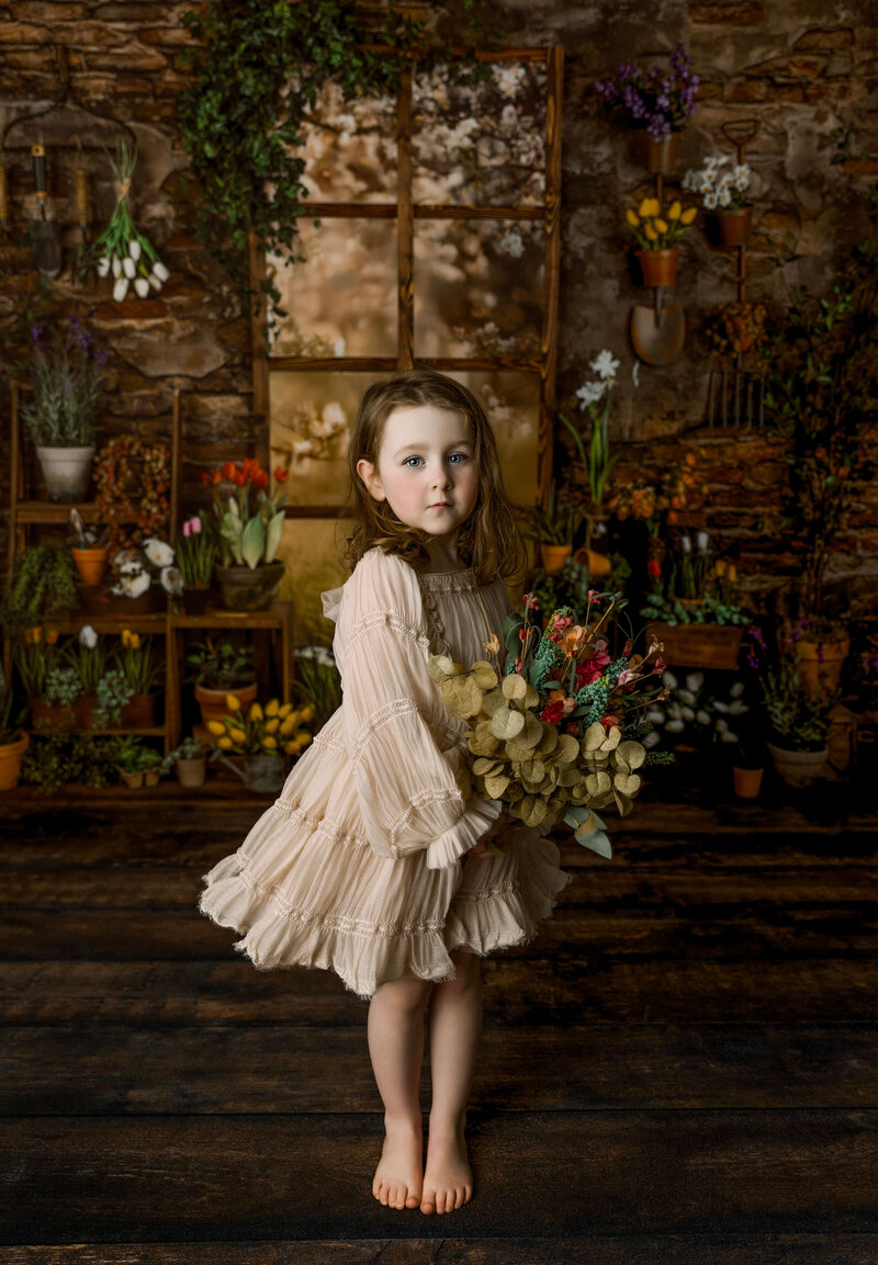 Spring  photo of a little girl holding flowers