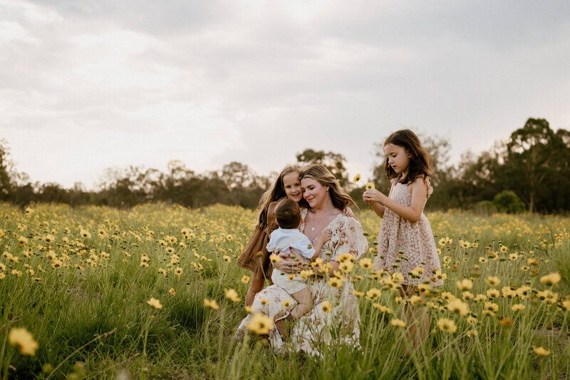 Family embraces newborn baby - Family photography in Brisbane / Family photos in Brisbane