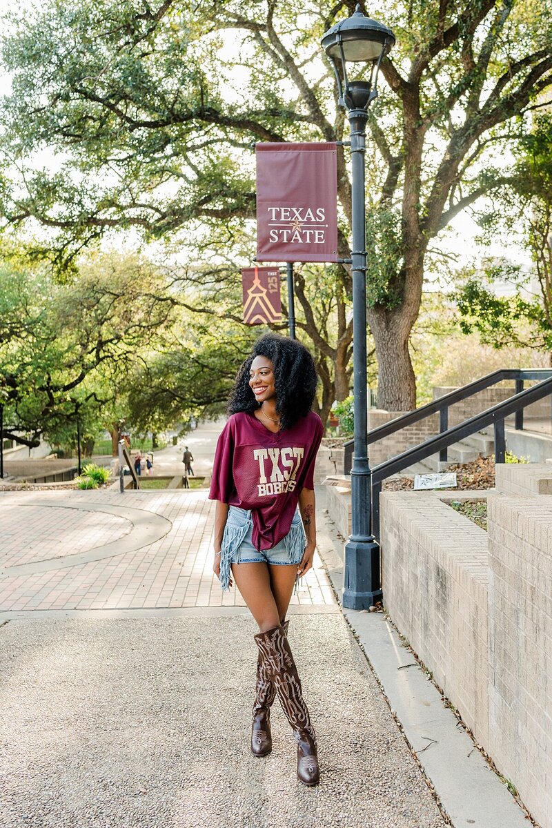 Texas State grad photos by Old Main 