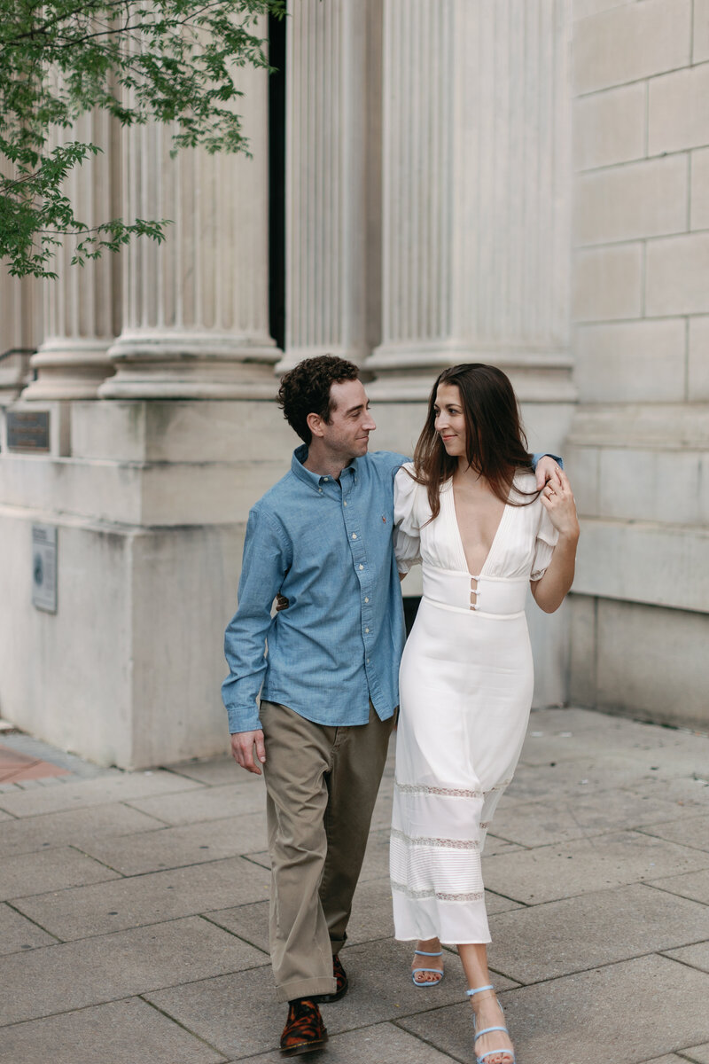 Couple laughing while strolling through downtown Raleigh North Carolina