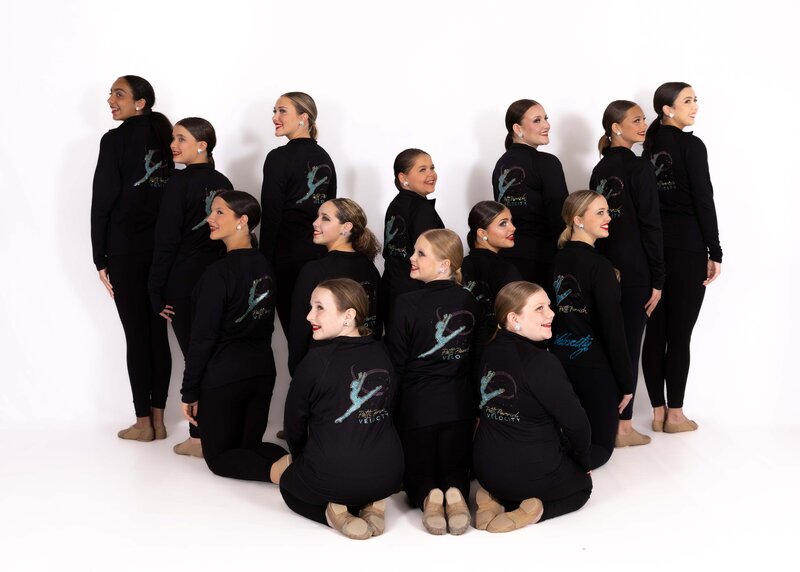 velocity team members in their team jackets