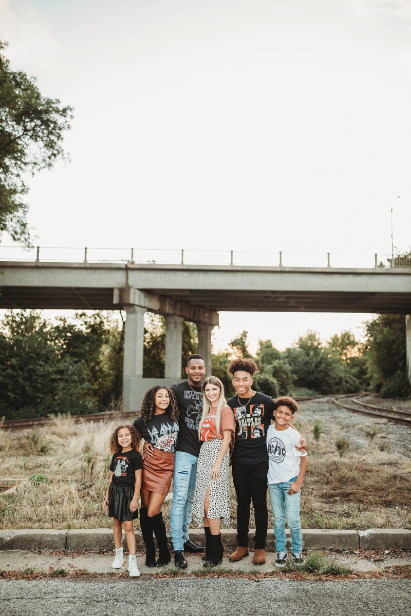 photo of a family near a bridge