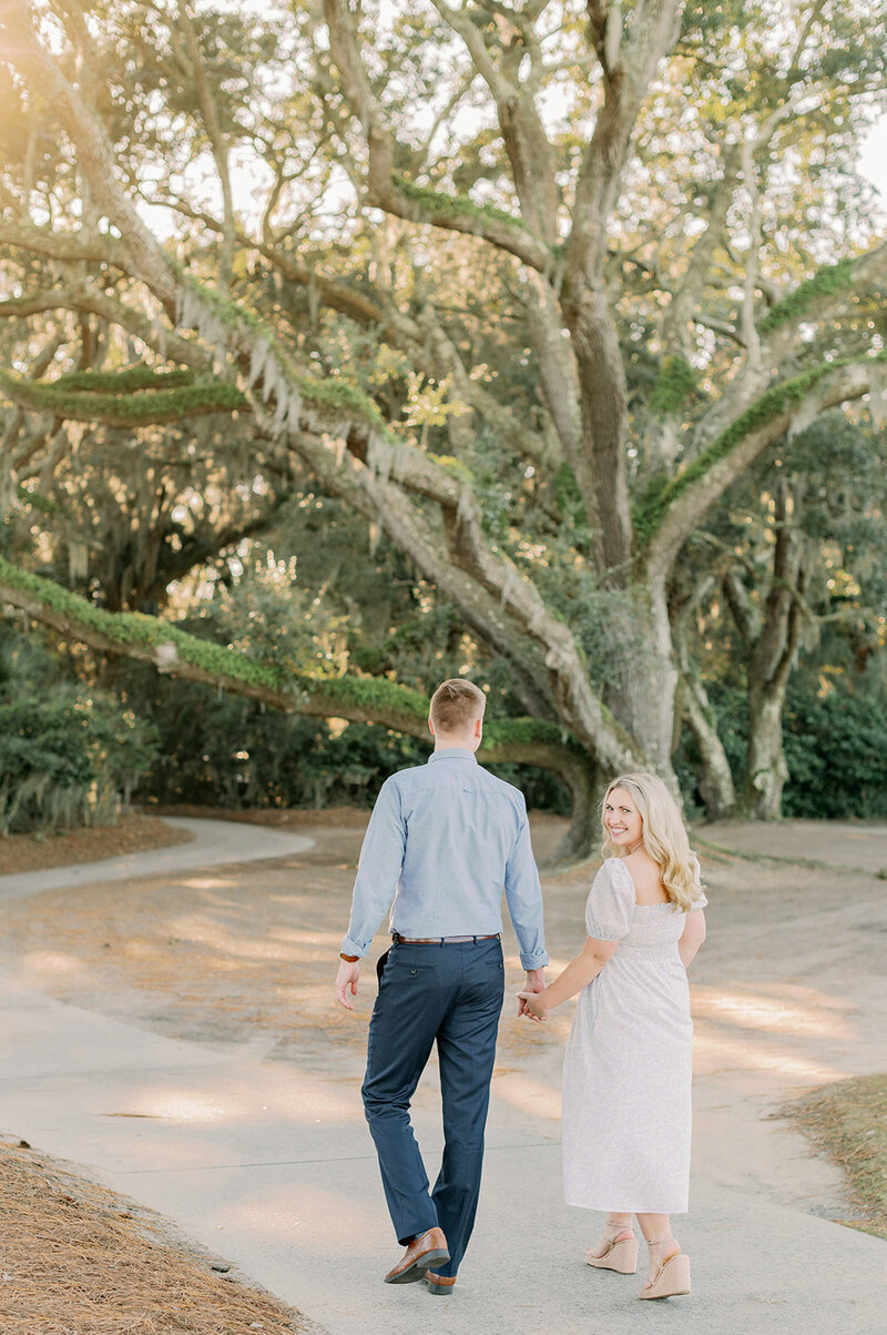 Aerial Drone photo of couple walking on charleston beach