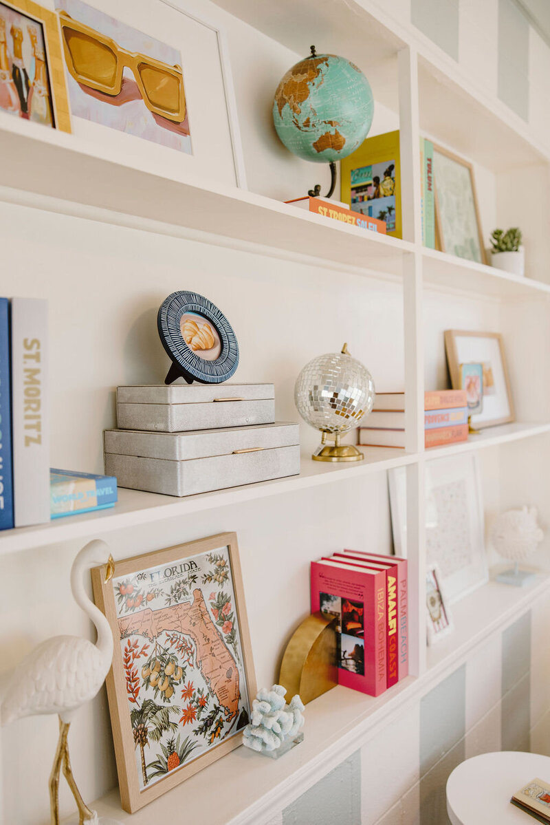 white built-in bookshelf with accessories