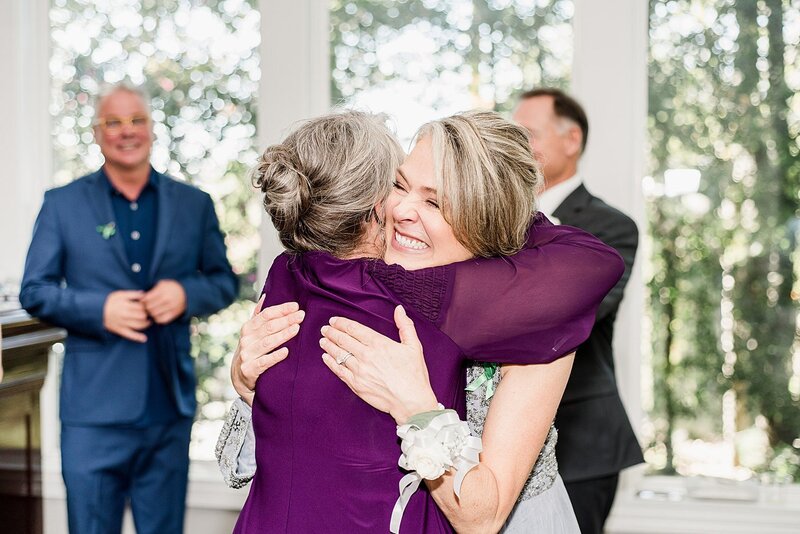 women hugging by knoxville wedding photographer, amanda may photos