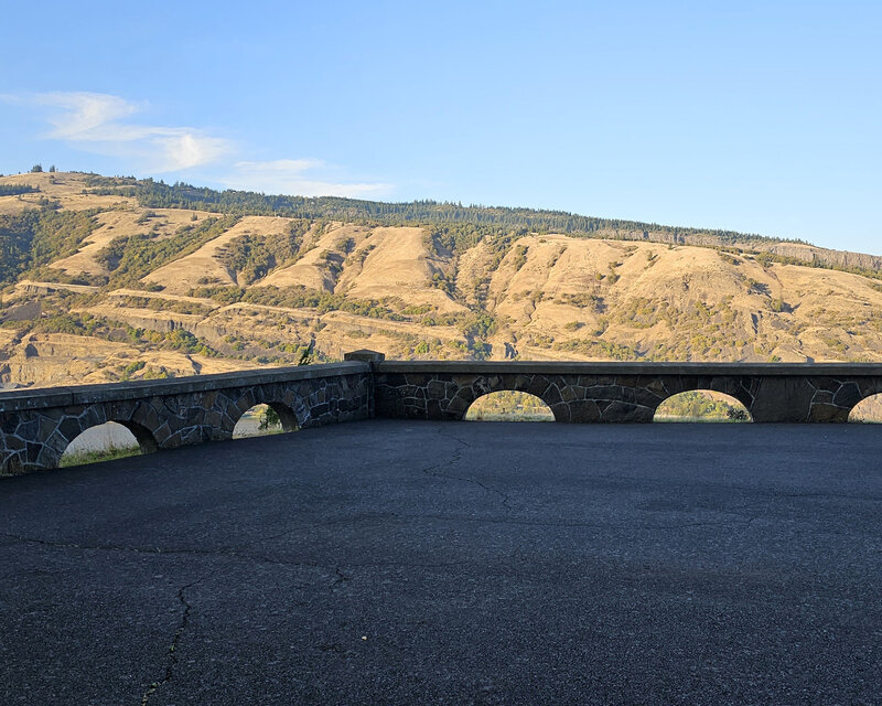 Appreciate the picturesque scenery and rolling hills from a shaded lookout along this scenic path in Mosier with The Gorge E-Bike Adventure Rentals