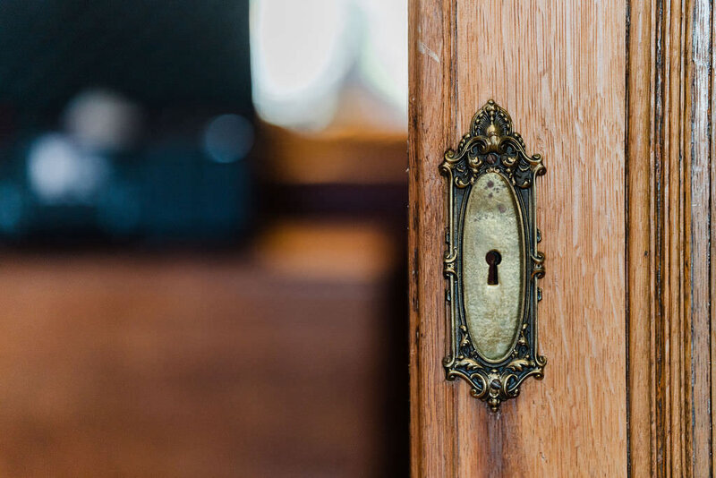 historic brass lock on wooden door