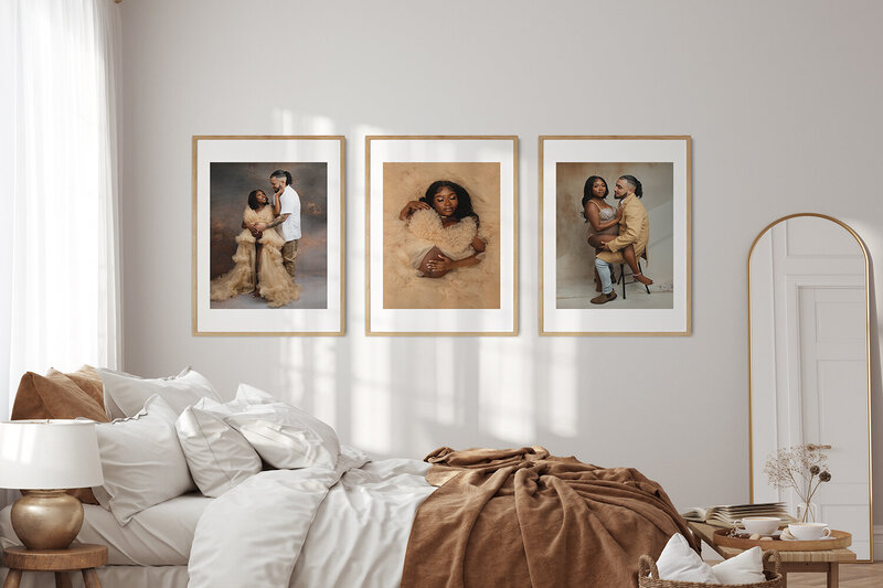 A view of a bedroom with three maternity photos printed hanging on the wall
