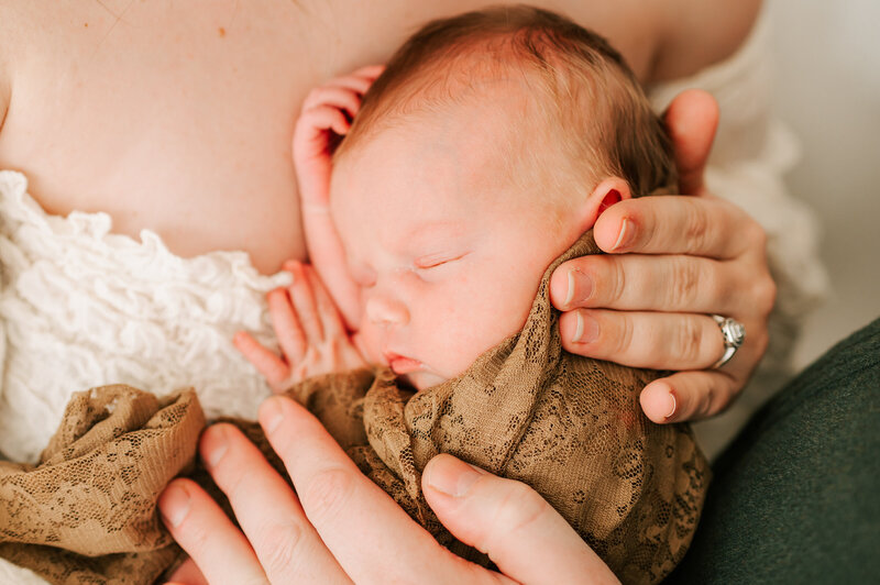 sleeping baby wrapped in lace blanket during Springfield MO newborn photography session