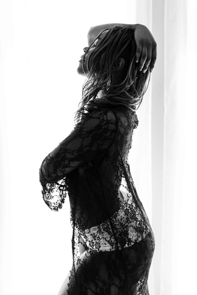 Boudoir photo of woman in black lace