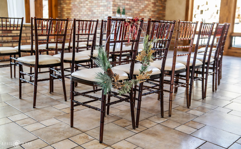 Ceremony chairs set up for indoor winter wedding at Della Terra in Estes Park