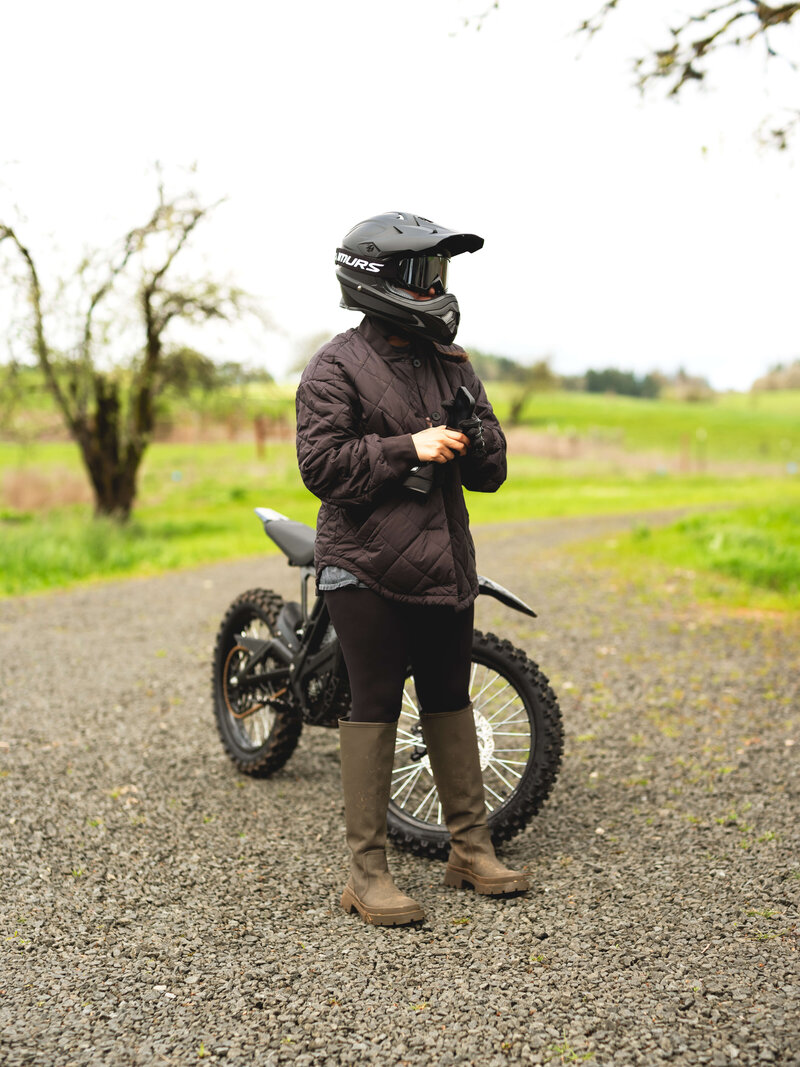 Dirt Bike Rider standing next to E-Bike