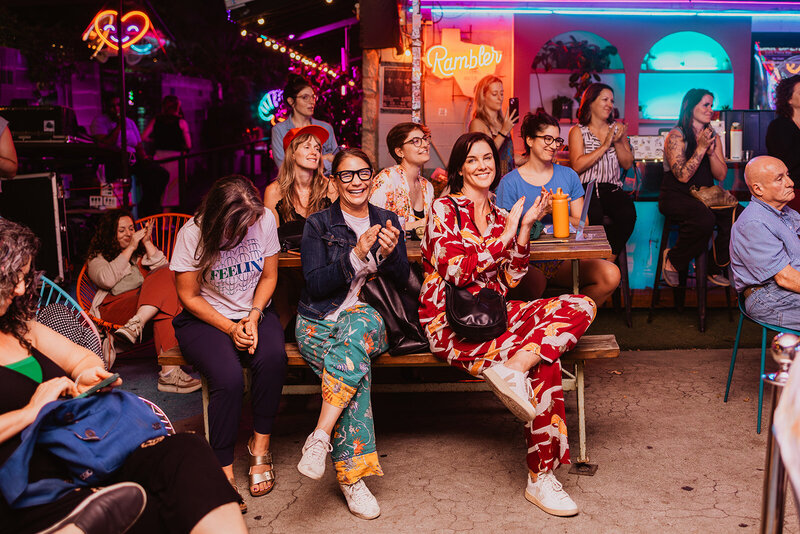 Guests clap at a non-profit event hosted by Unhushed in Austin, Texas
