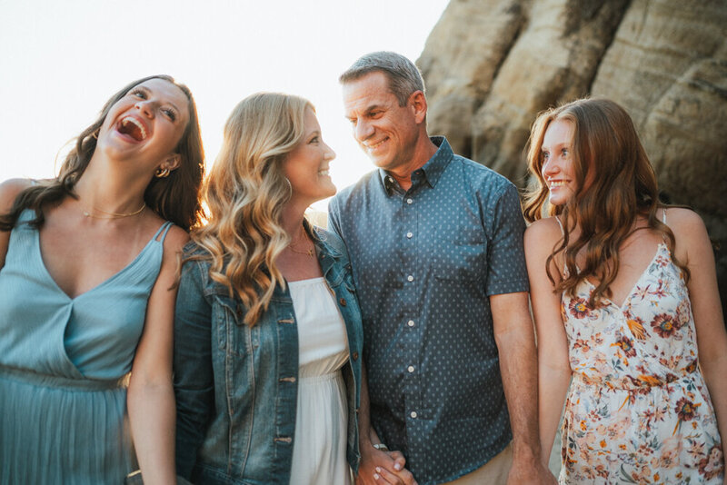 mom cuddling sons during photography session with Portland family photographer