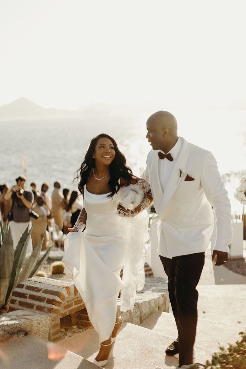 Wedding couple smiles after exchanging rings at their Sunset Monalisa wedding