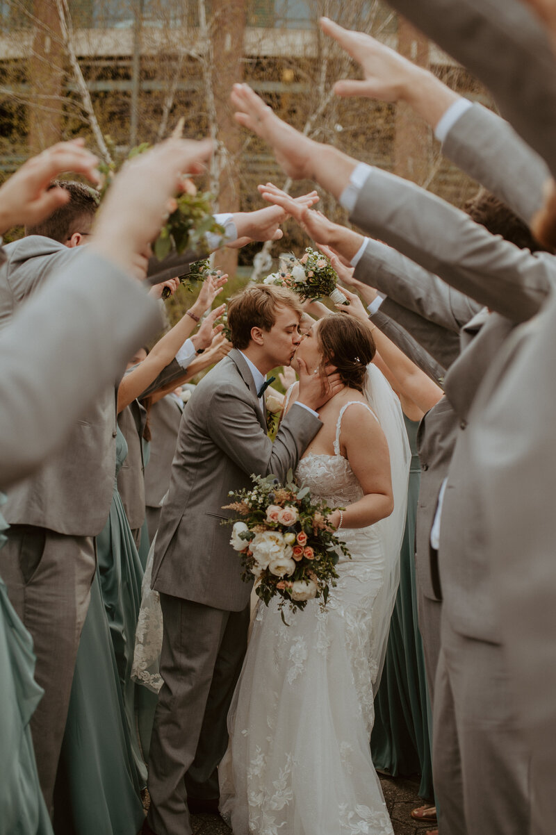 married couple sitting at boho wedding alter