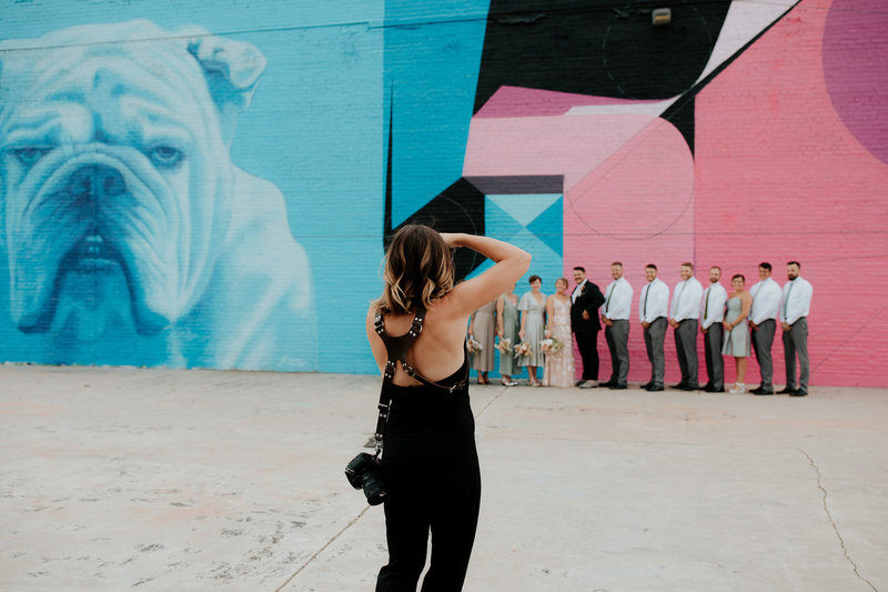 Emily of Sweet Justice photography working with groomsmen to capture a special and unique photo to be cherished always.