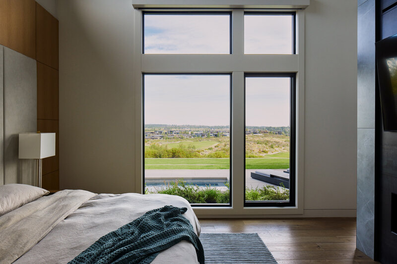 mountain-modern-home-bedroom-tall-windows-luxury-panel-walls