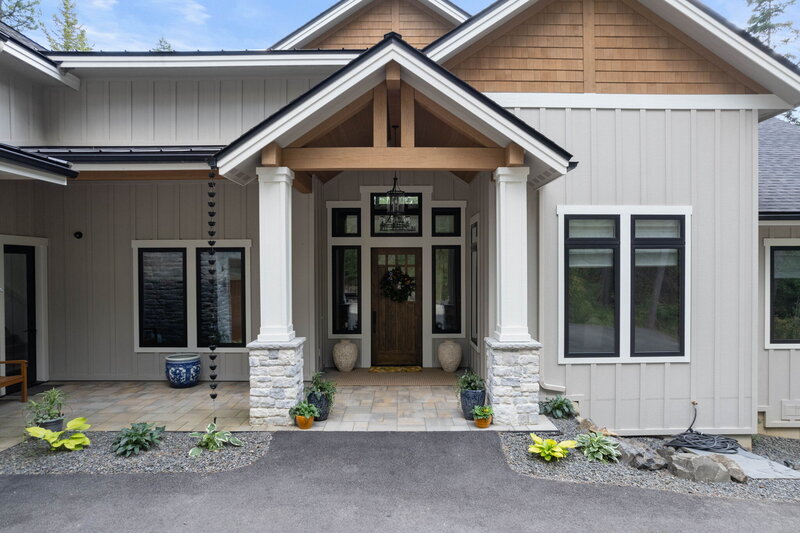 The exterior and front door of a home designed by Coeur d'Alene interior design firm Sarro Design.