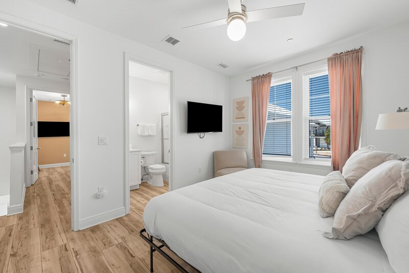 Spacious king bedroom with ensuite bathroom at Beach Cabana in Panama City Beach, perfect for vacationers heading to 30A, Grayton Beach, and Alys Beach.