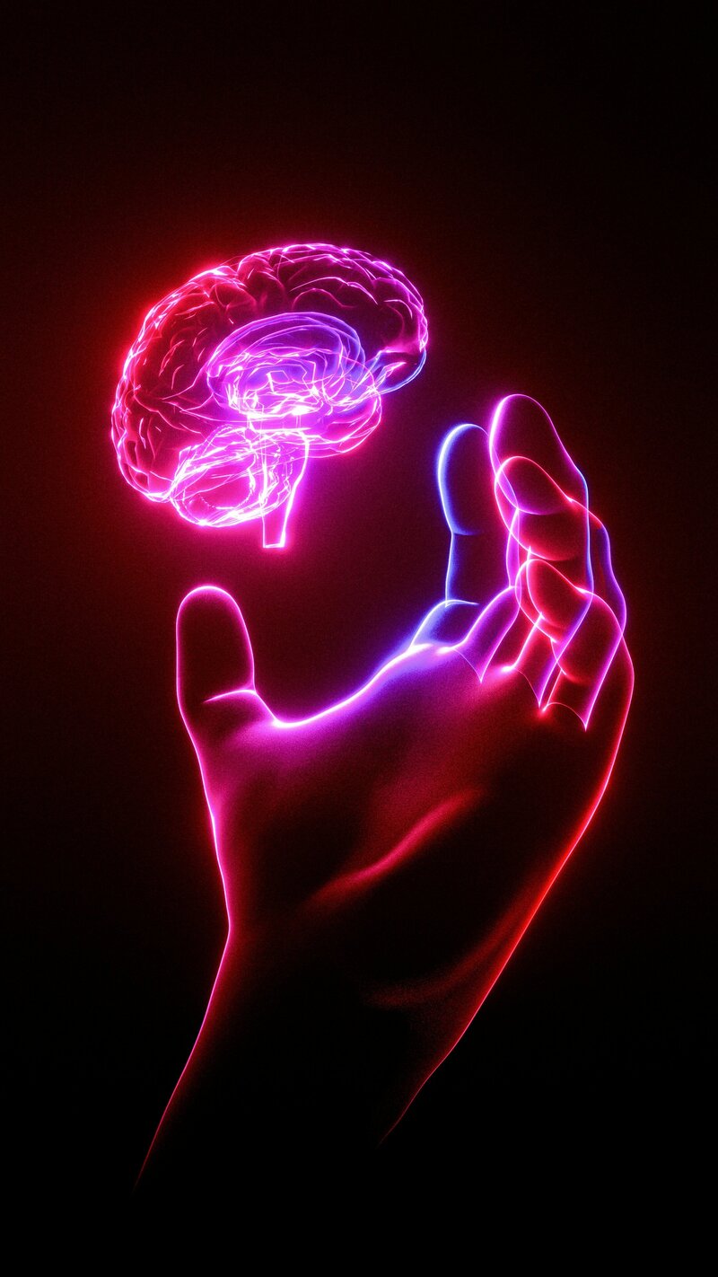 Picture of neon hand holding a neon brain