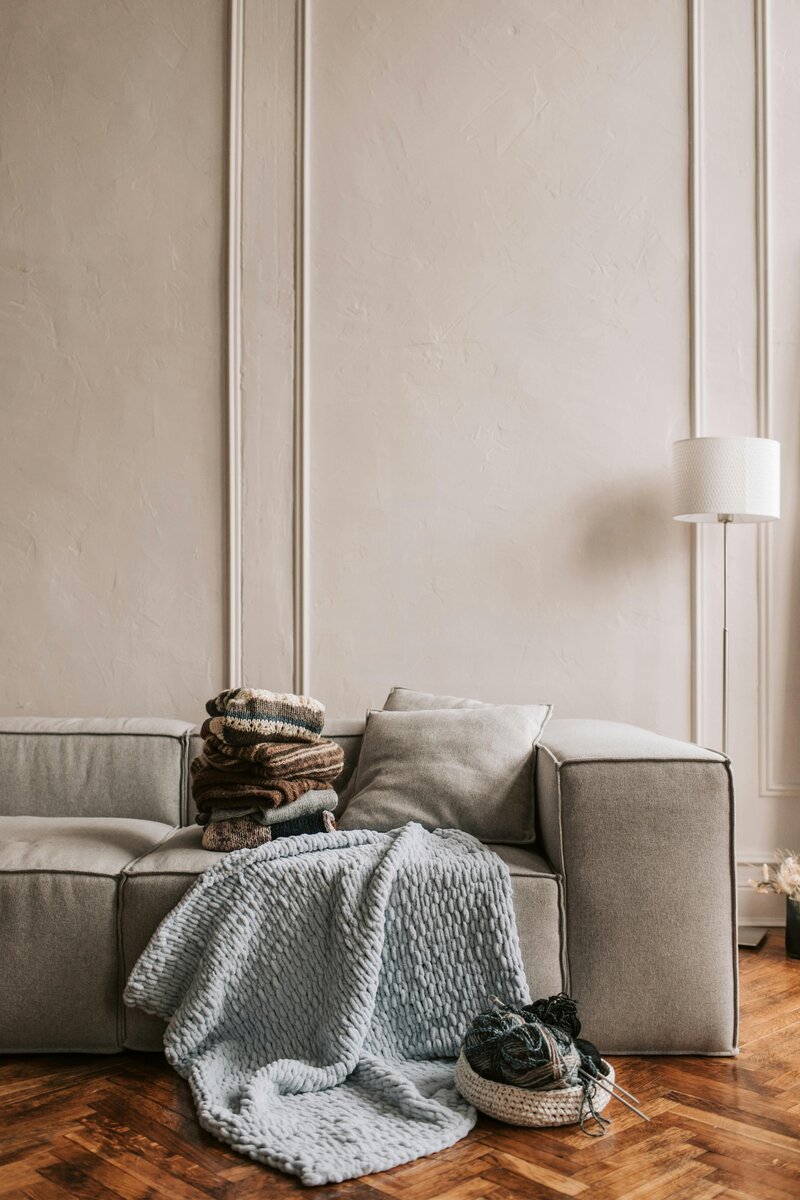 A comfortable beige sofa in a calming therapy office setting, creating a welcoming space for clients at Emily Austin Therapy.