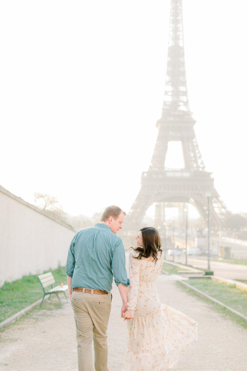 Traveling wedding and motherhood photographer who takes family photos in eau claire wisconsin standing in paris france