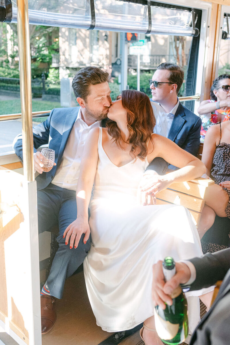 newlyweds kiss on trolley