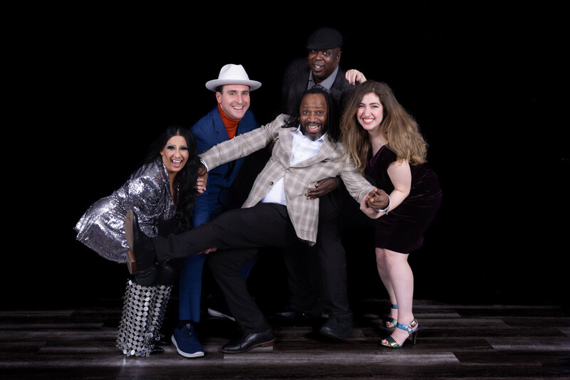 Charizma DJs and dancers striking a pose at a Chicago corporate party with club-style lighting