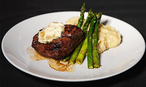 Filet Mignon with roasted garlic-thyme-shallot butter garlic mashed gold potatoes