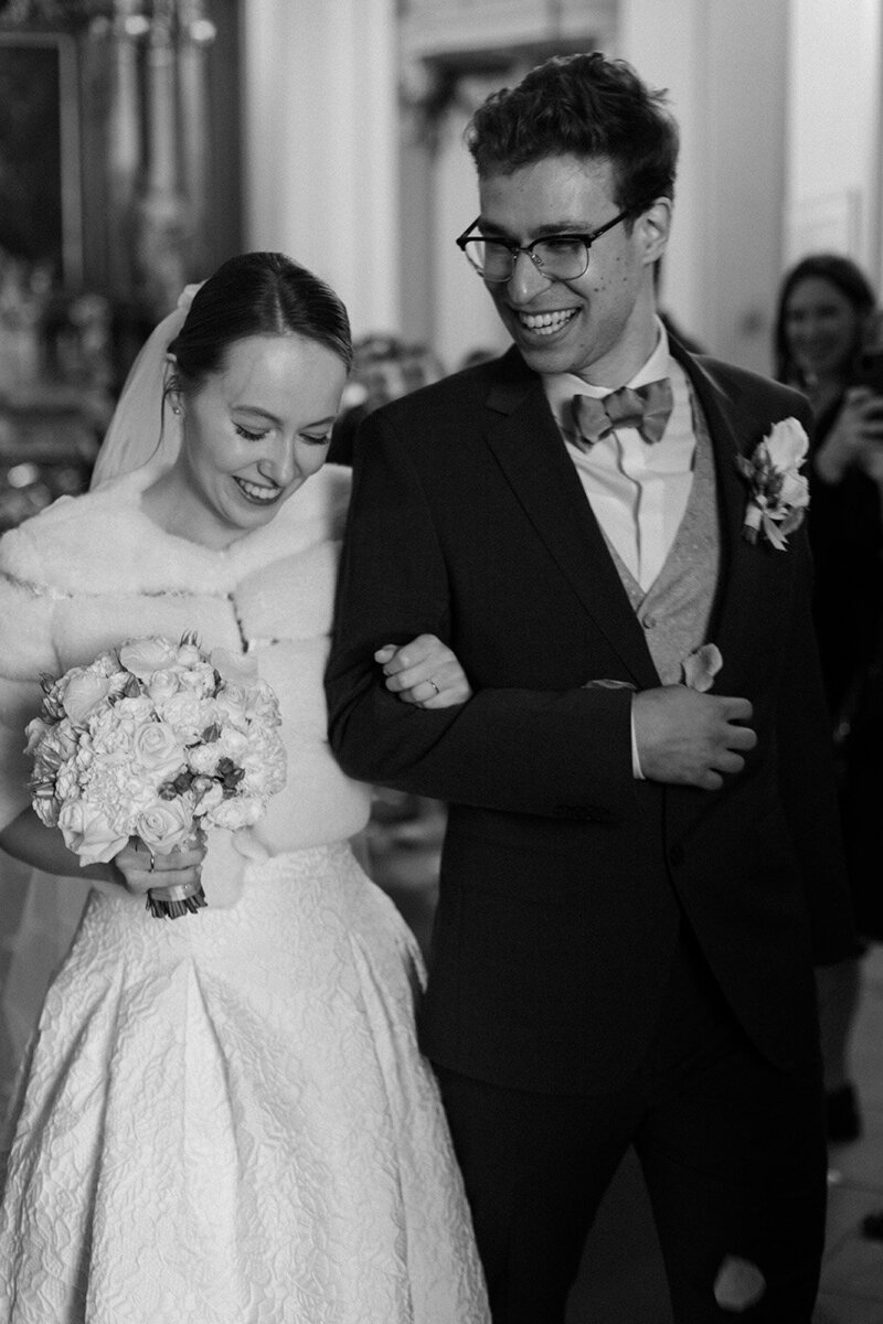 Luxury wedding in Europe – sophisticated bride in a modern wedding gown and groom in a timeless suit.
