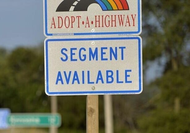 Sign with words "Adopt a Highway"