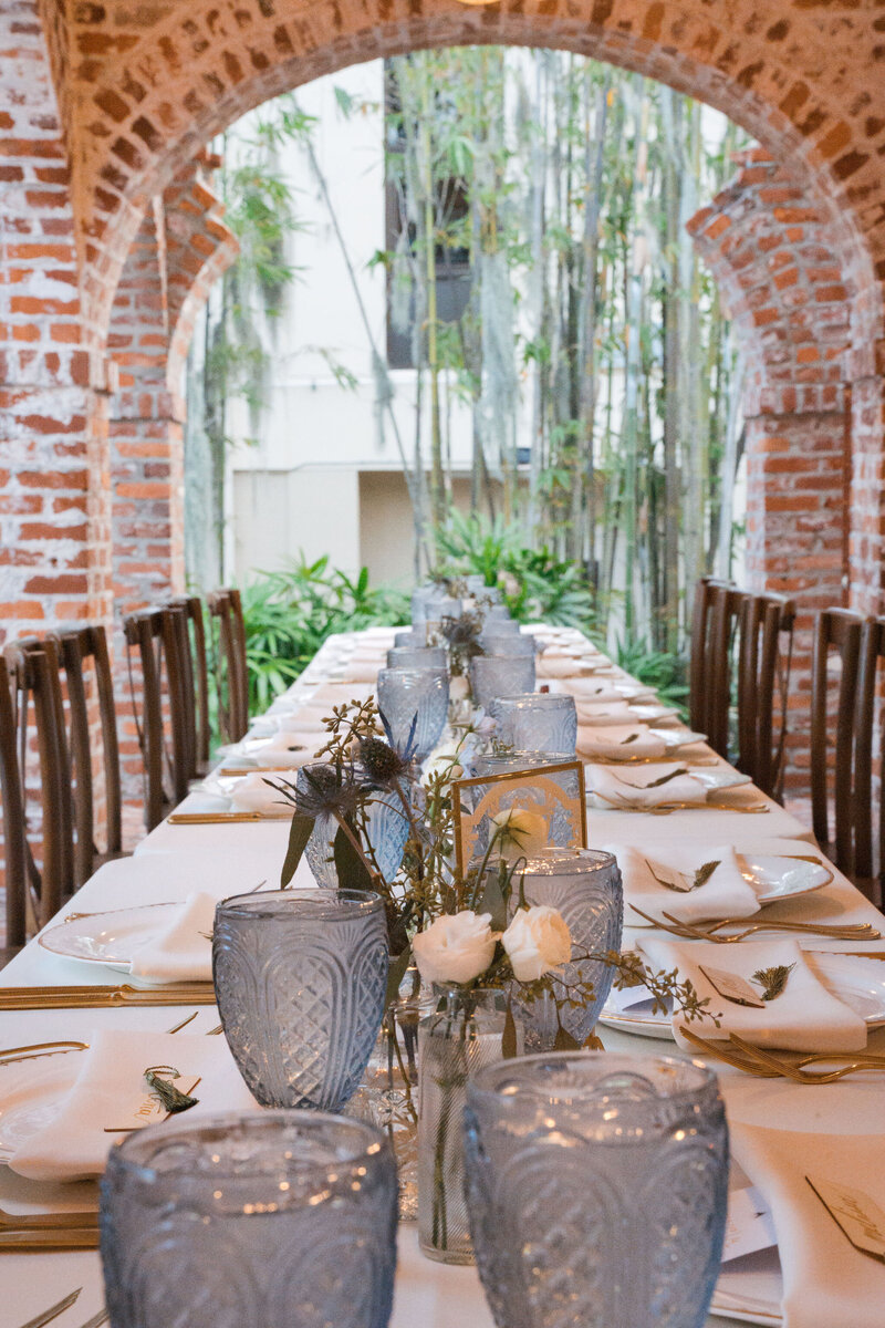 Vintage-inspired wedding reception setup with bundt cakes and garden florals