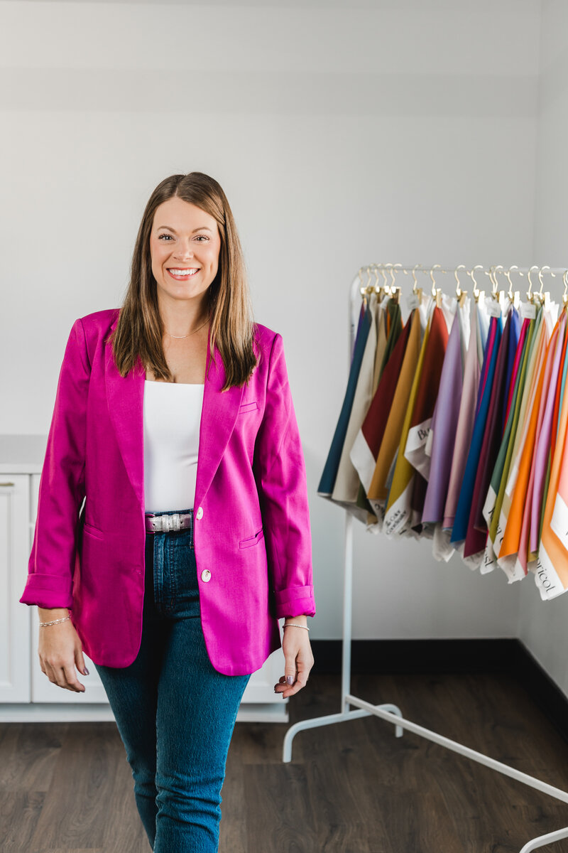 Elizabeth standing by a laptop