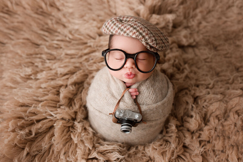 baby boy wrapped up during his newborn photo session done by new jersey baby photographer