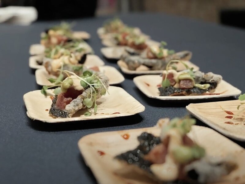 Small single serving plates of food on a table 