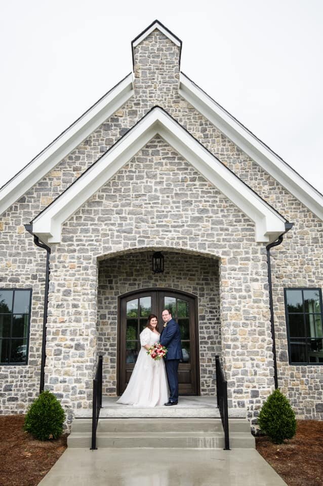 Bride and groom outside venue