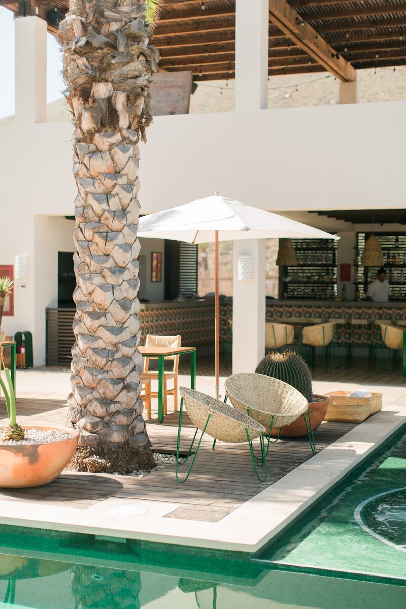 Luxury resort in Mexico with wicker chairs by the pool