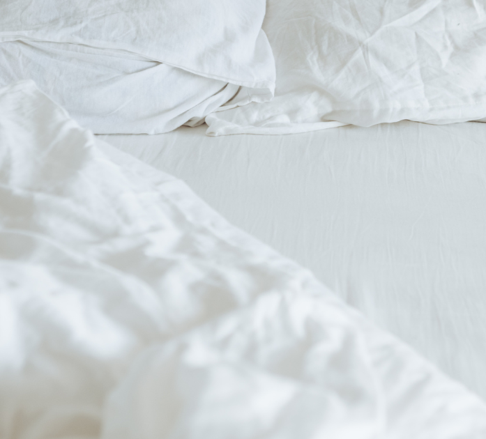 White sheets symbolizing restful sleep benefits of Sleep Blend IV Vitamin Therapy at Refined Medical NY in East Setauket, Long Island.