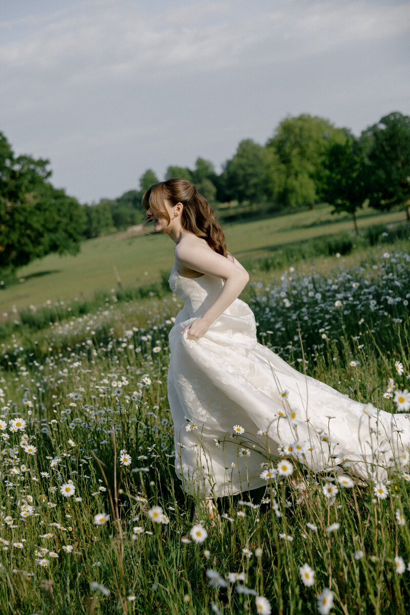 California editorial wedding photographer with a bride running through a field 