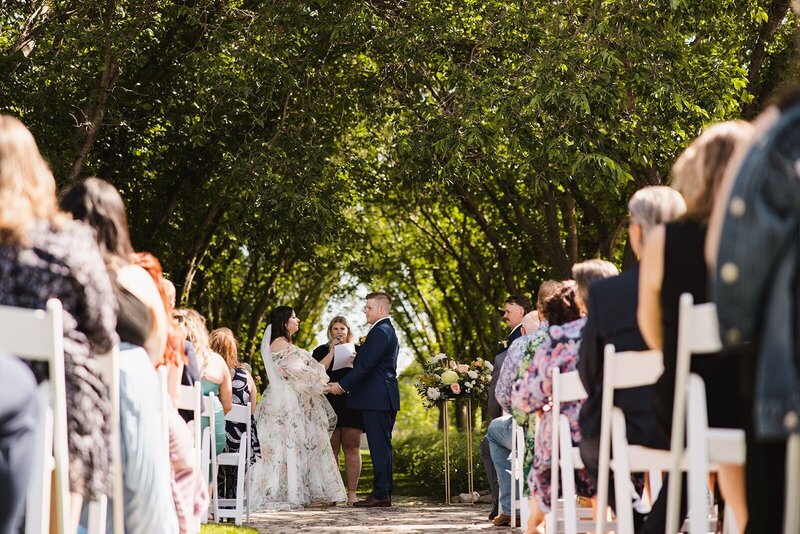 Couple standing together during their ceremony.