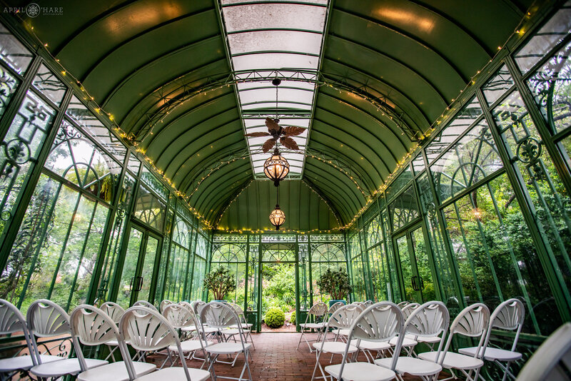 Interior Photo of a June wedding set up inside of the Woodland Mosaic Solarium at Denver Botanic Gardens