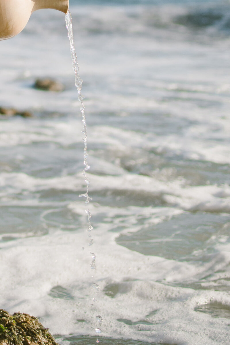Ocean waves meeting the beach with white foam, soft pastel water tones used for Santelle portfolio visual