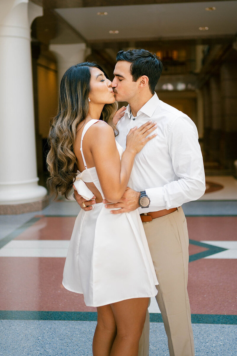 Couple kissing for engagement photos