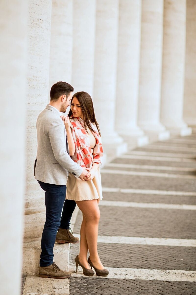 A stylish couple poses for their engagement session,