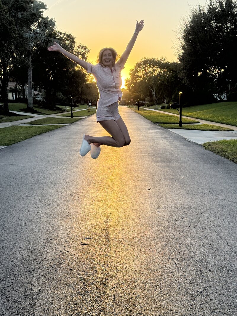 Jill sitting while holding a clipboard